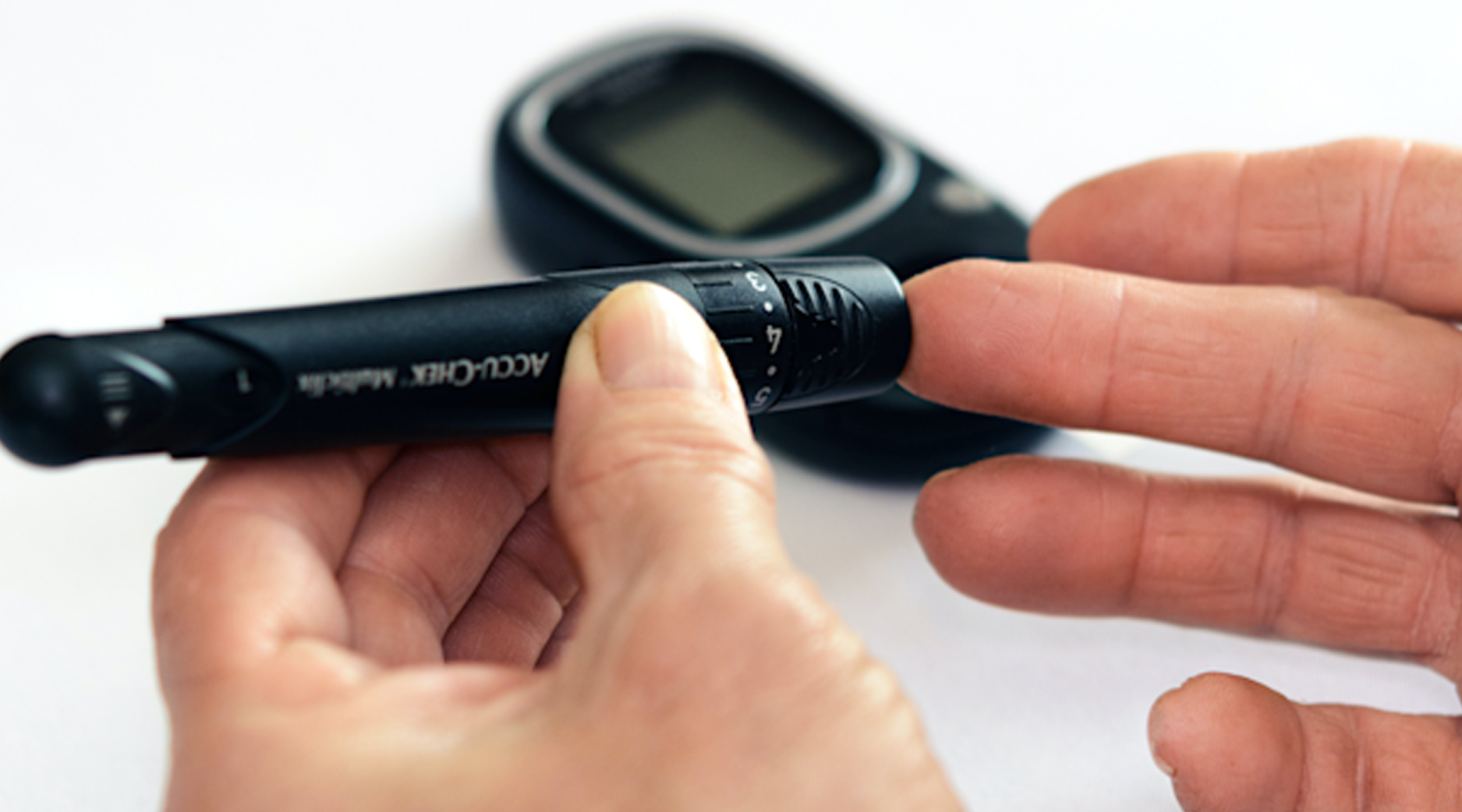 A person checking their sugar levels