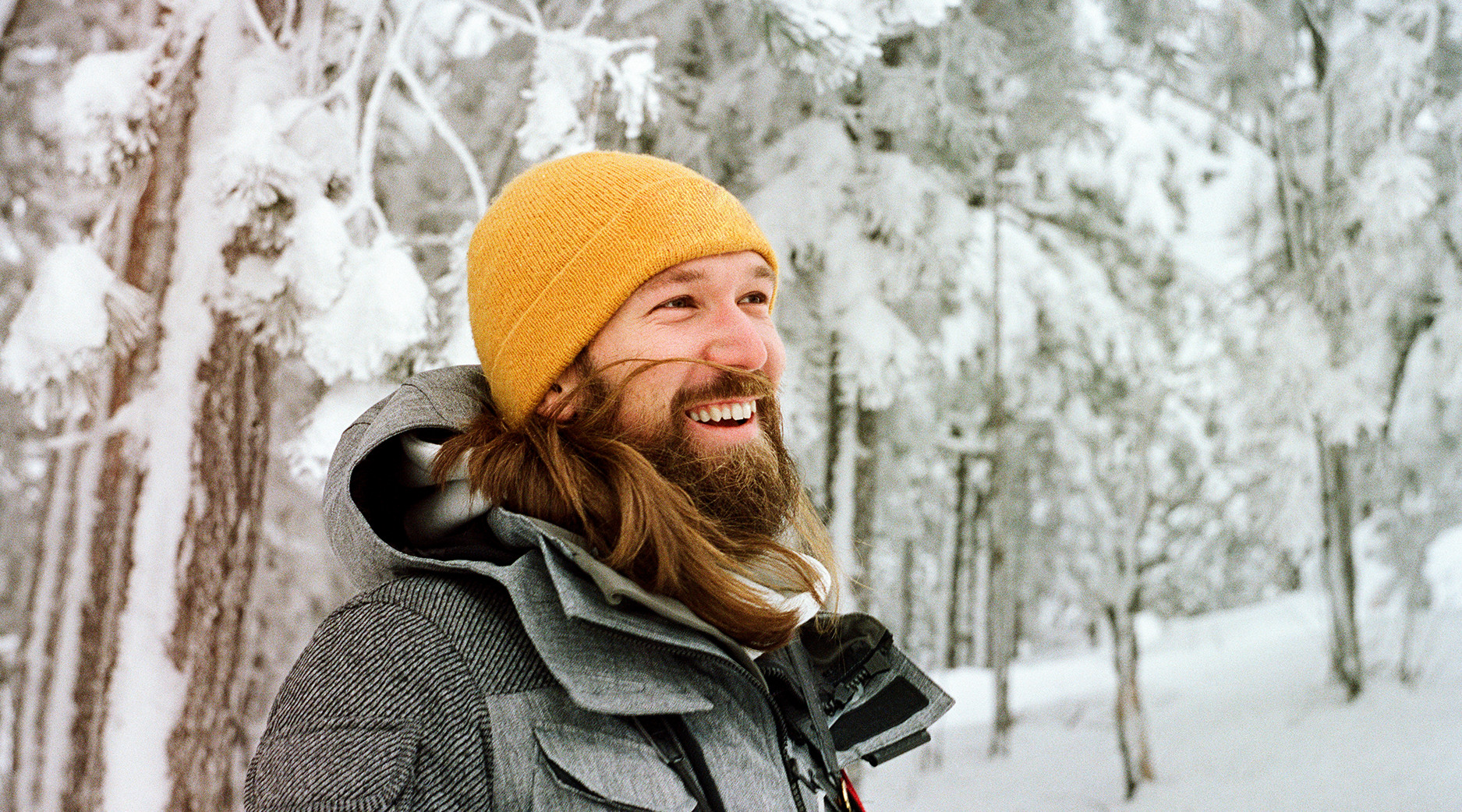 A man smiling in the snow